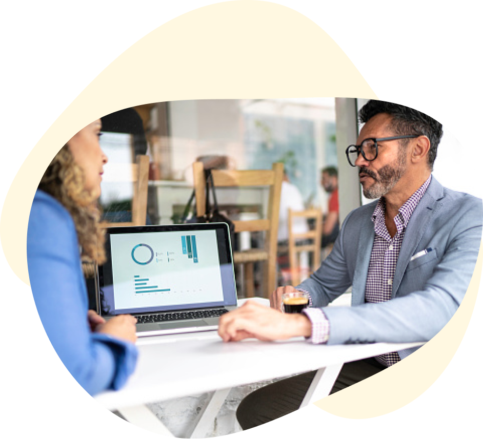 Man and woman in business meeting looking at analytics